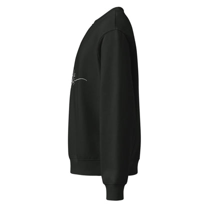 Black hoodie with a small white logo on the sleeve against a white background
