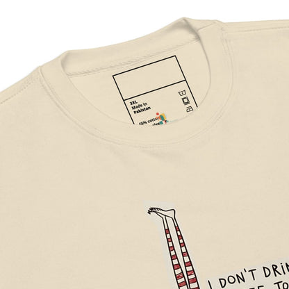 Beige t-shirt with a label and text on a white background