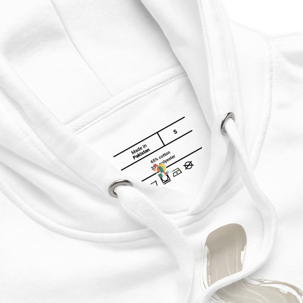 White garment on a hanger with a label showing fabric composition and care instructions.