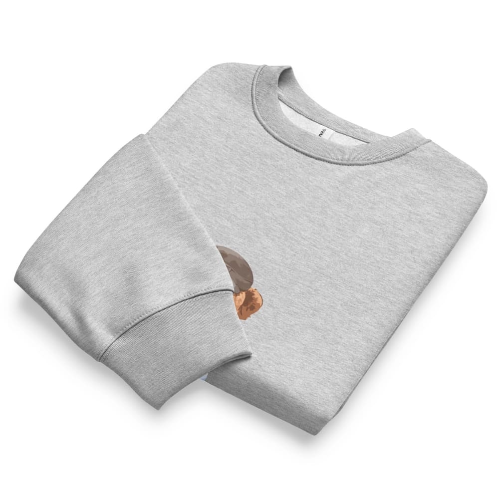 Folded gray sweatshirt with a small design on a white background