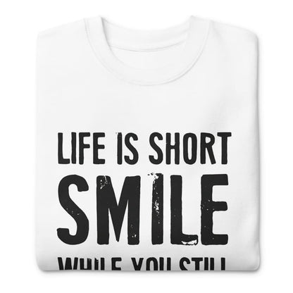 White sweatshirt with 'Life is short, smile while you still can' text on a white background