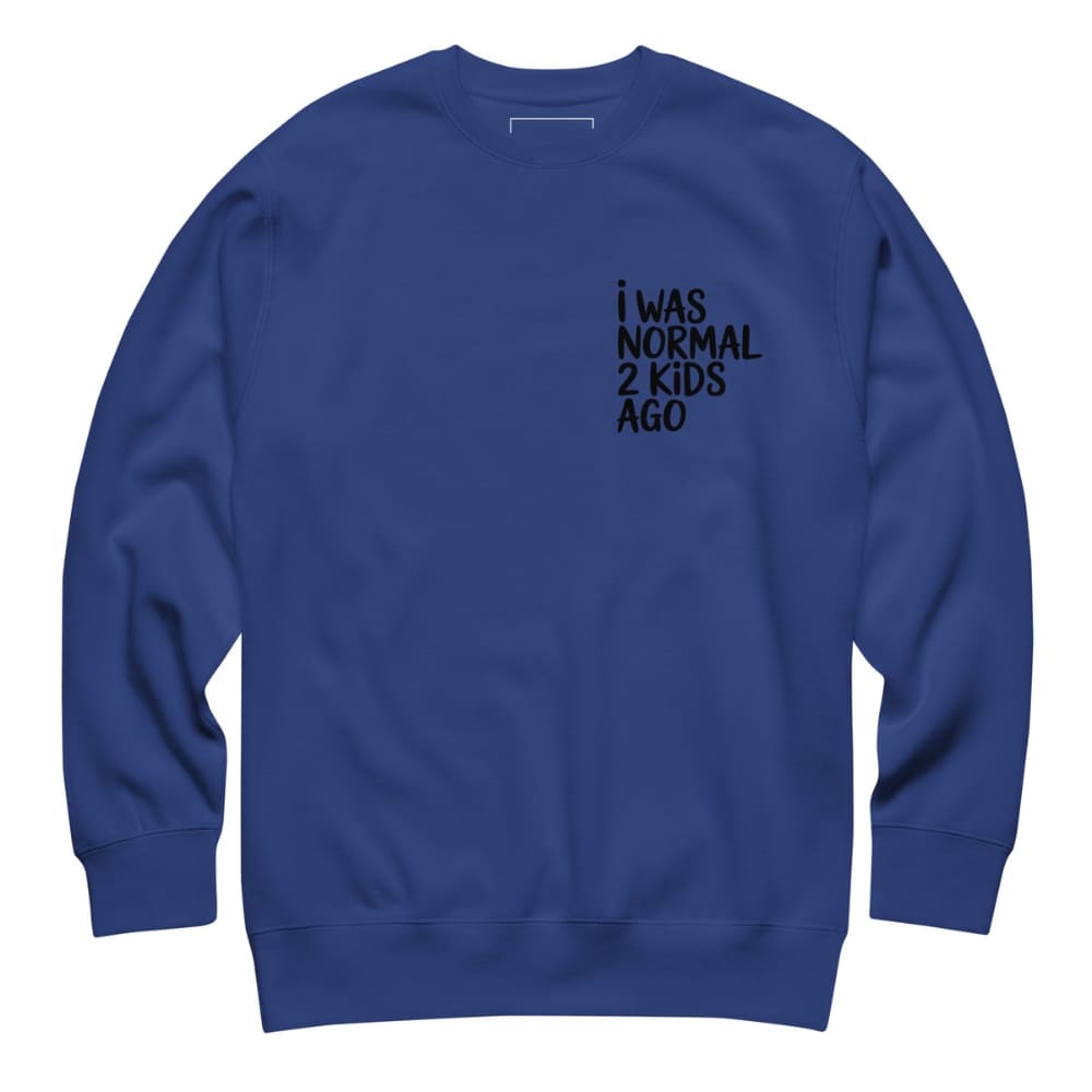 Blue sweatshirt with text 'I WAS NORMAL 2 KIDS AGO' on a white background