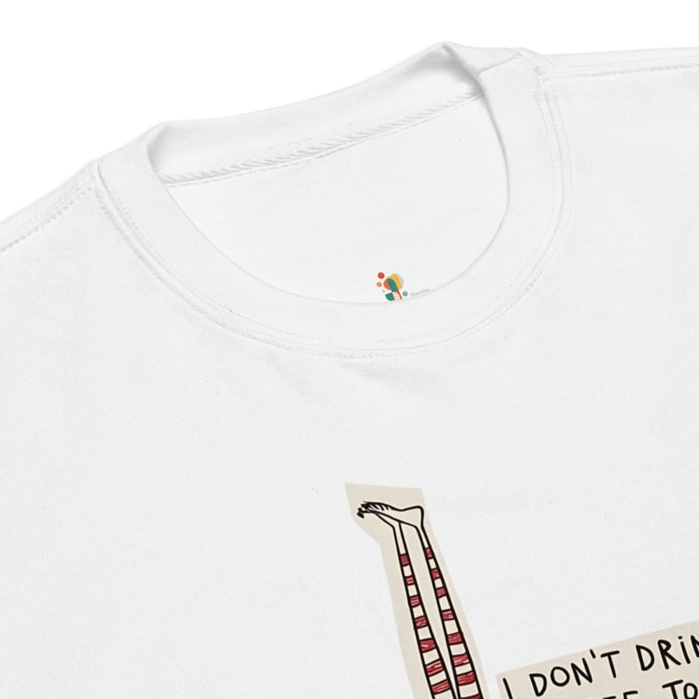 White shirt with a small embroidered design on the collar, next to a card with text.