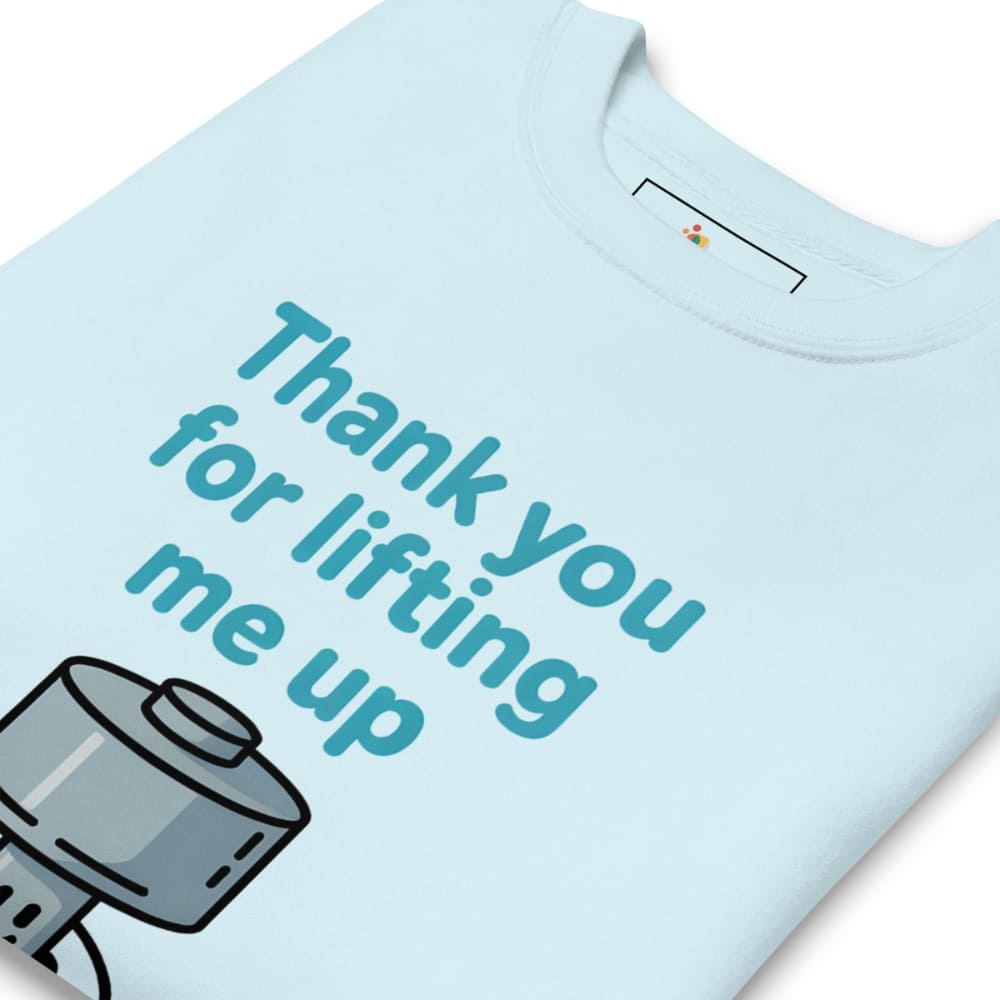 Light blue t-shirt with a graphic of a camera and text 'Thank you for lifting me up' on a white background.
