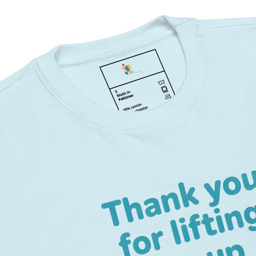 Light blue sweatshirt with text and a tag on a white background