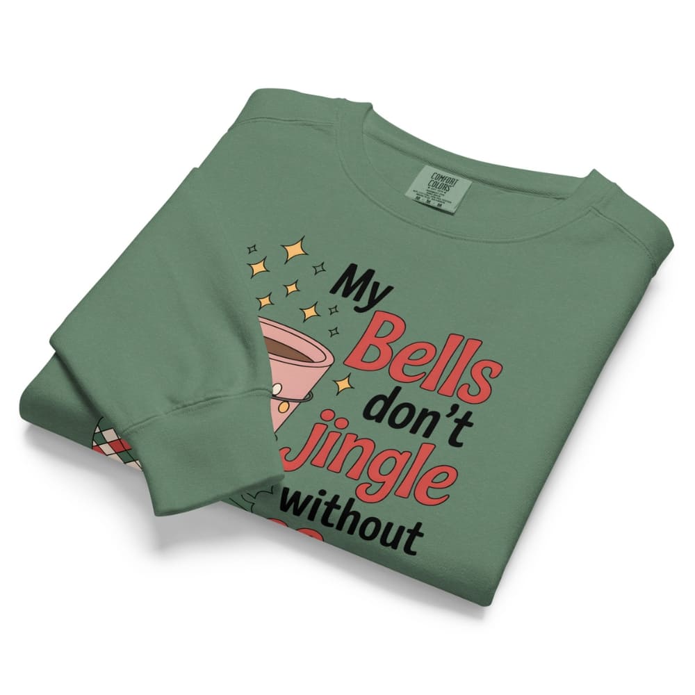 Folded green sweatshirt with humorous text design on a white background