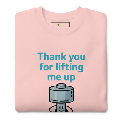 Pink sweatshirt with a robot graphic and text 'Thank you for lifting me up' on a white background