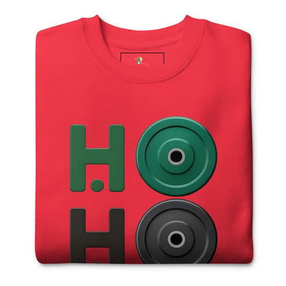 Folded red t-shirt with green and black graphic design on a white background