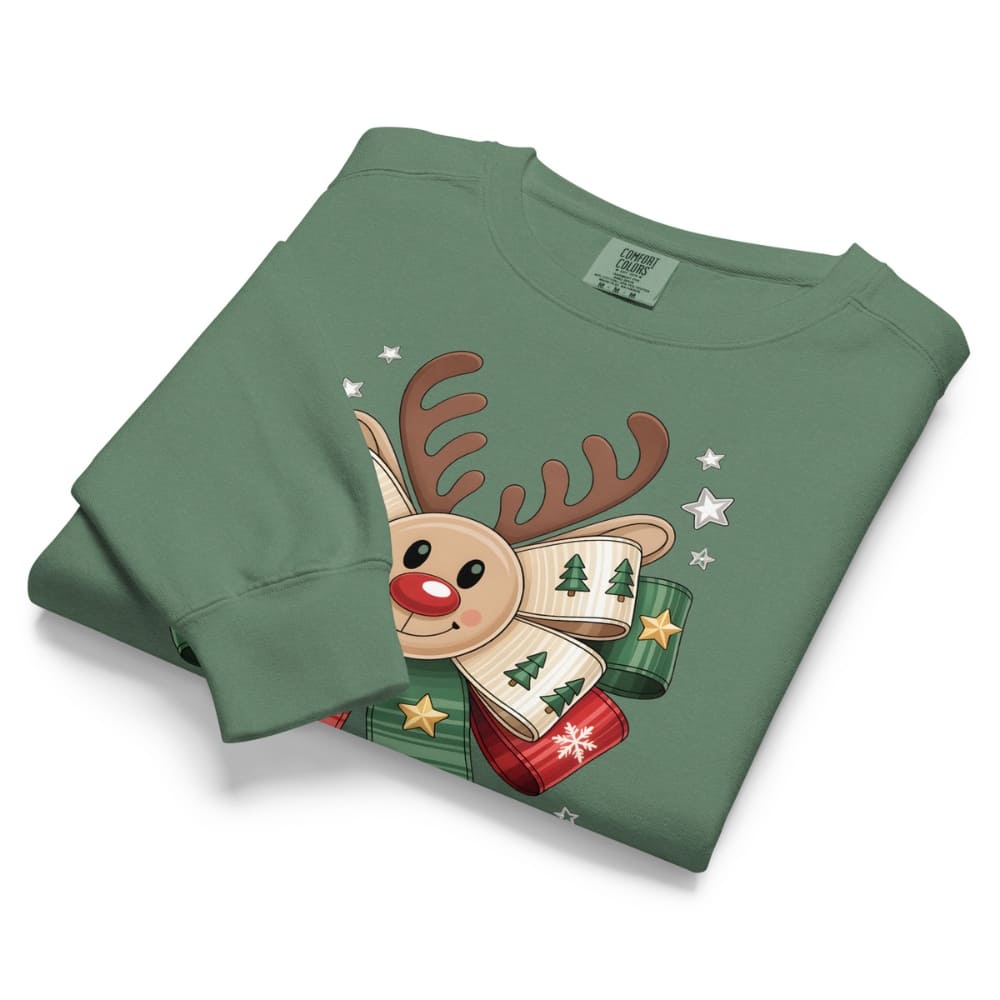 Folded green sweatshirt with a reindeer design on a white background