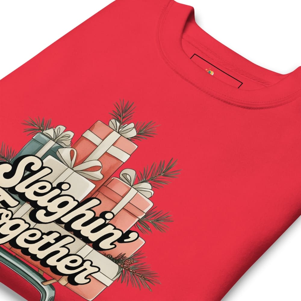 Red t-shirt with Christmas-themed design featuring presents and 'Sleighin' Together' text.