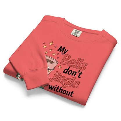 Folded coral sweatshirt with text and graphic design on a white background
