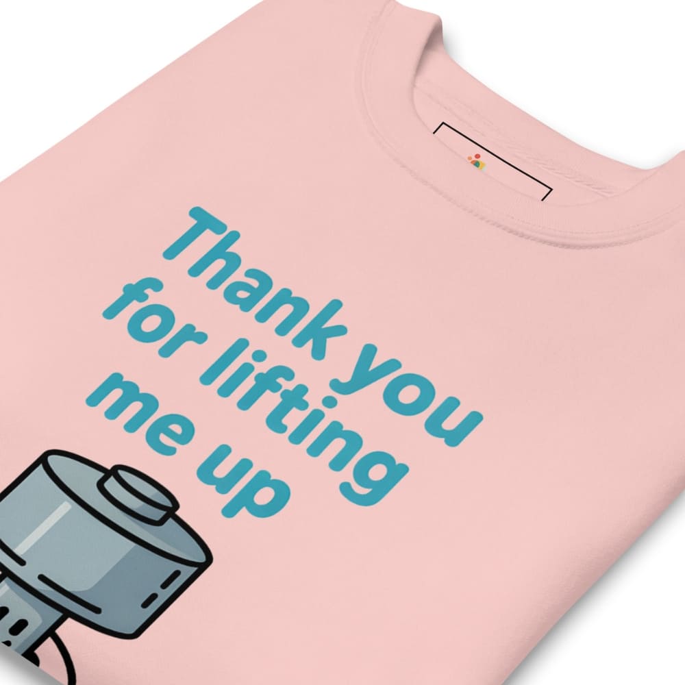 Pink t-shirt with a graphic of a camera and text 'Thank you for lifting me up' on a white background