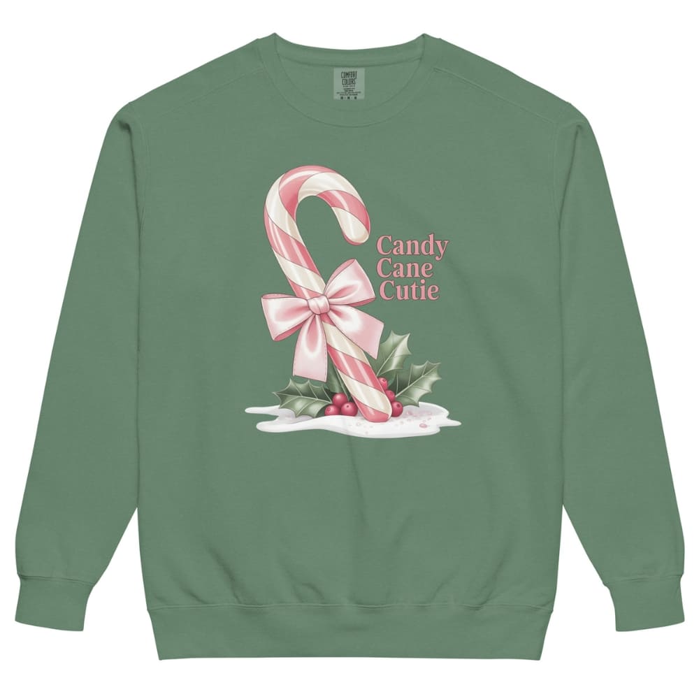 Green sweatshirt with candy cane and bow design on a white background
