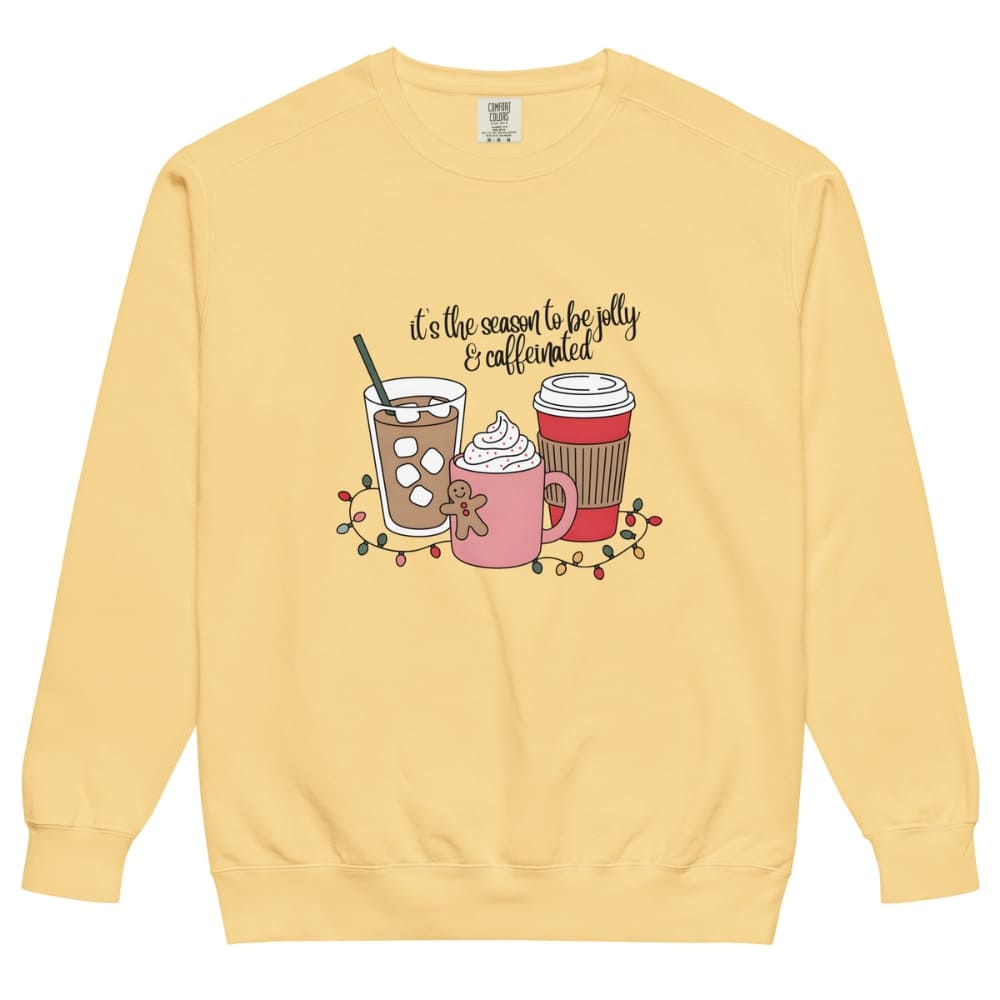 Yellow sweatshirt with coffee-themed graphic and text on a white background