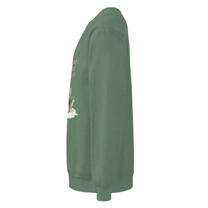 Green sweatshirt with floral design on sleeve against a white background