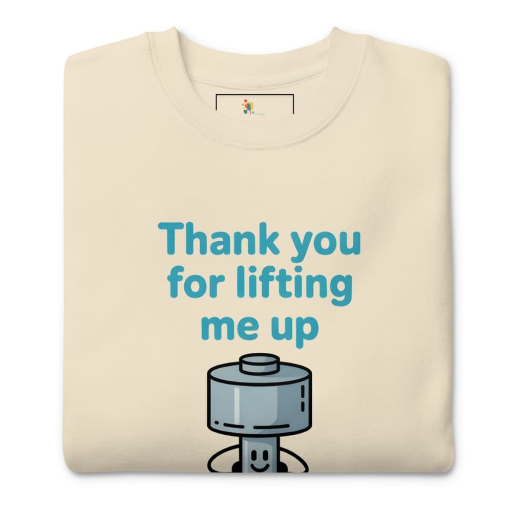 Beige t-shirt with a robot graphic and text 'Thank you for lifting me up' on a white background