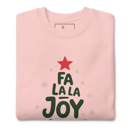 Folded pink sweatshirt with 'Fa La La Joy' text and red star design on a white background