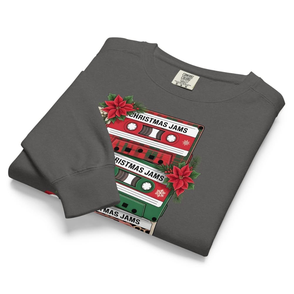 Folded gray sweatshirt with Christmas jams cassette design on a white background