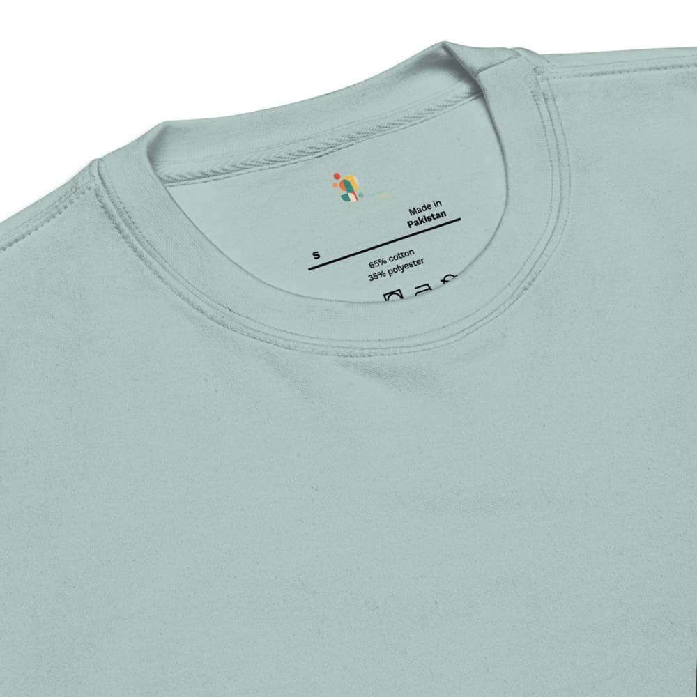 Close-up of a light blue t-shirt with a label on the collar.