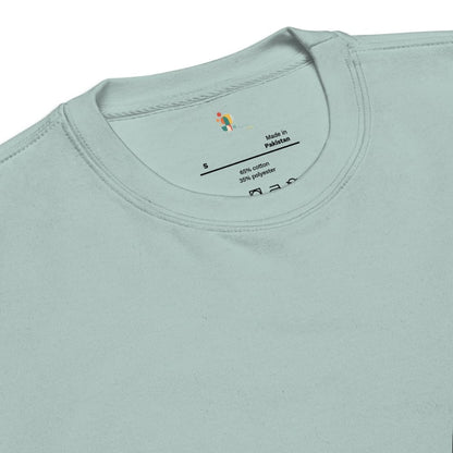 Close-up of a light blue t-shirt with a label on the collar.