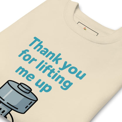Beige t-shirt with blue text 'Thank you for lifting me up' and a graphic of a hand holding a heart.