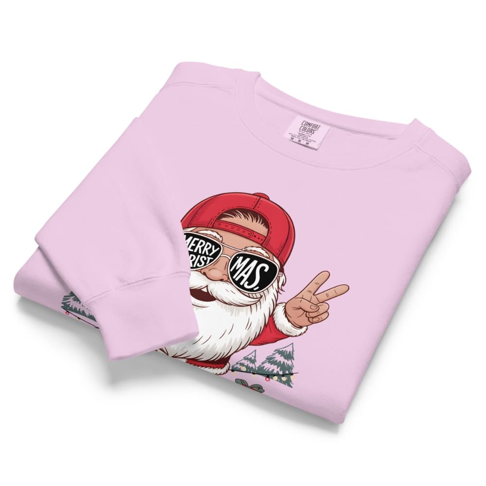 Folded pink sweatshirt with a graphic of a Santa Claus-like character on a white background