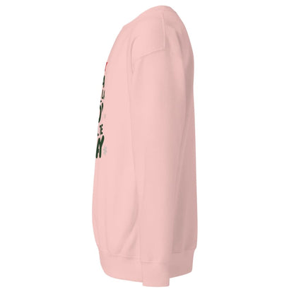 Pink hoodie with text on the sleeve against a white background