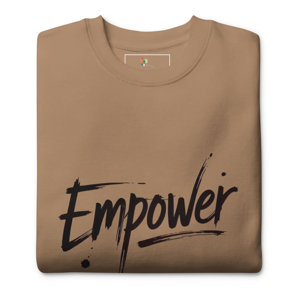 Folded brown t-shirt with 'Empower' text on a white background