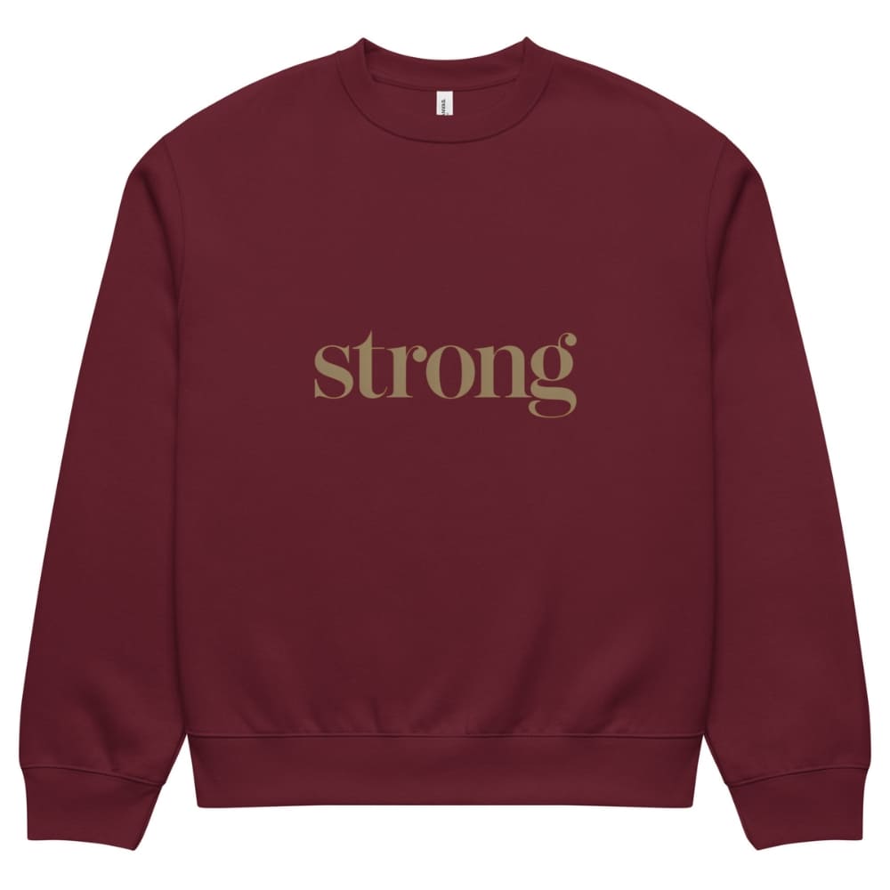 Maroon sweatshirt with 'strong' text in gold on a white background