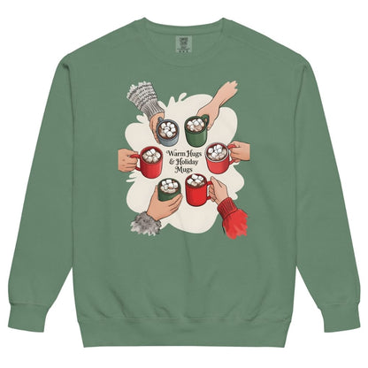 Green sweatshirt with a graphic of hands holding mugs and hot cocoa, on a white background.
