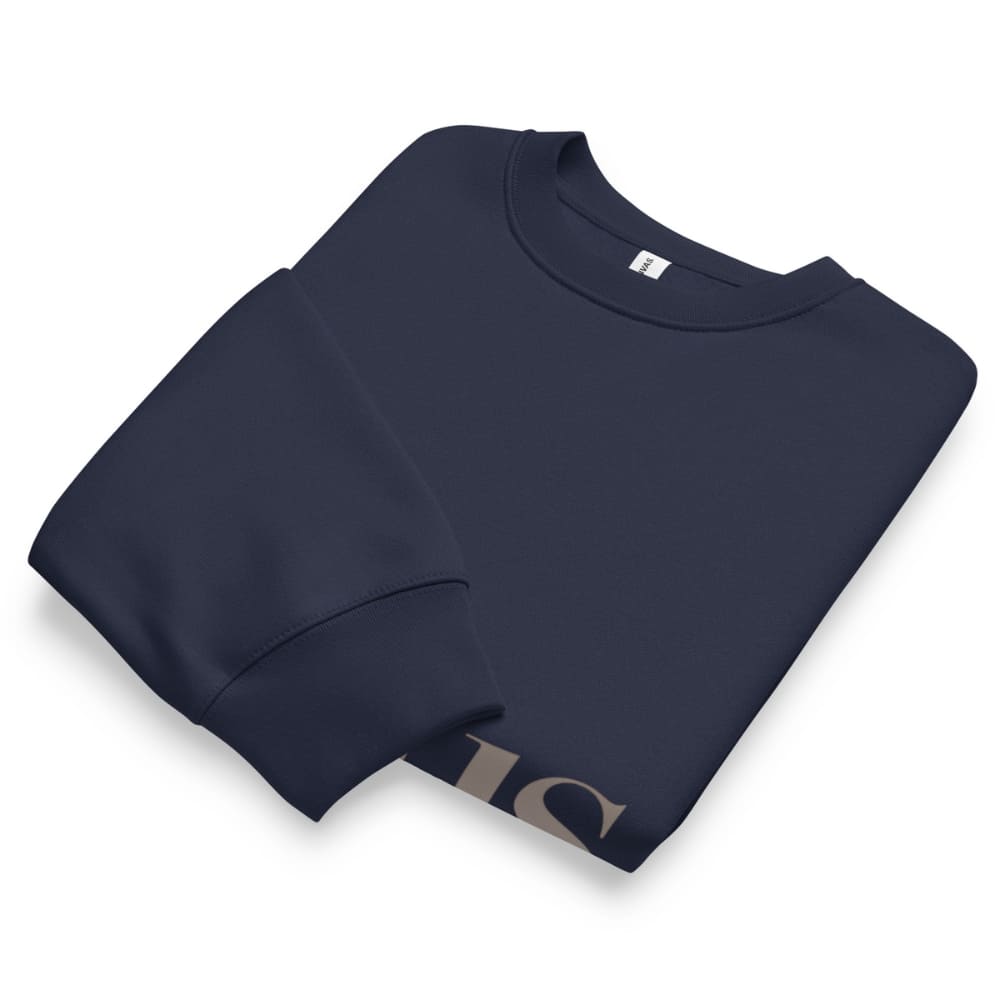 Folded navy blue sweatshirt on a white background