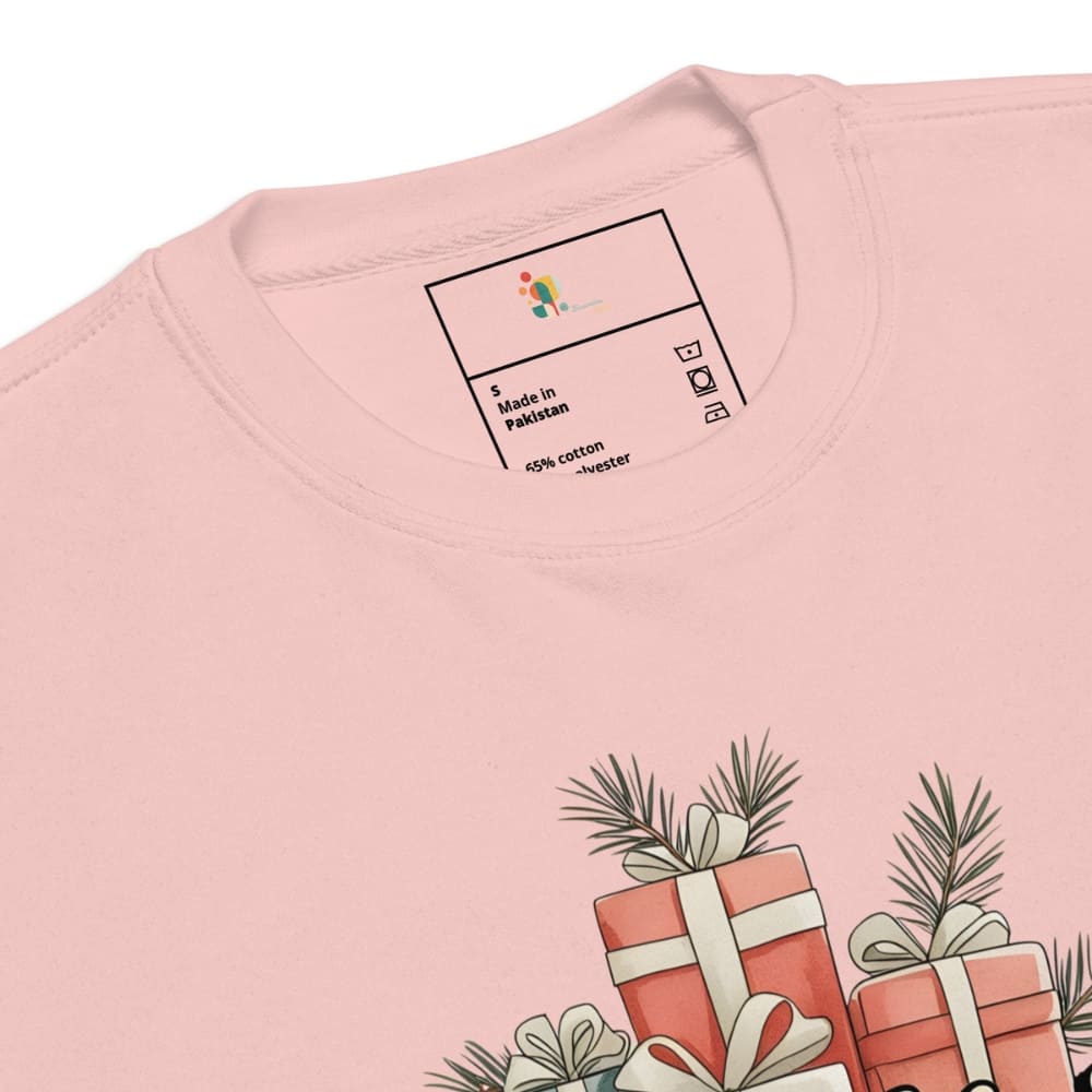 Close-up of a pink t-shirt with a label and graphic design on a white background