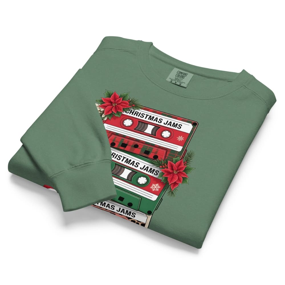 Green sweatshirt with Christmas-themed cassette tape design on a white background