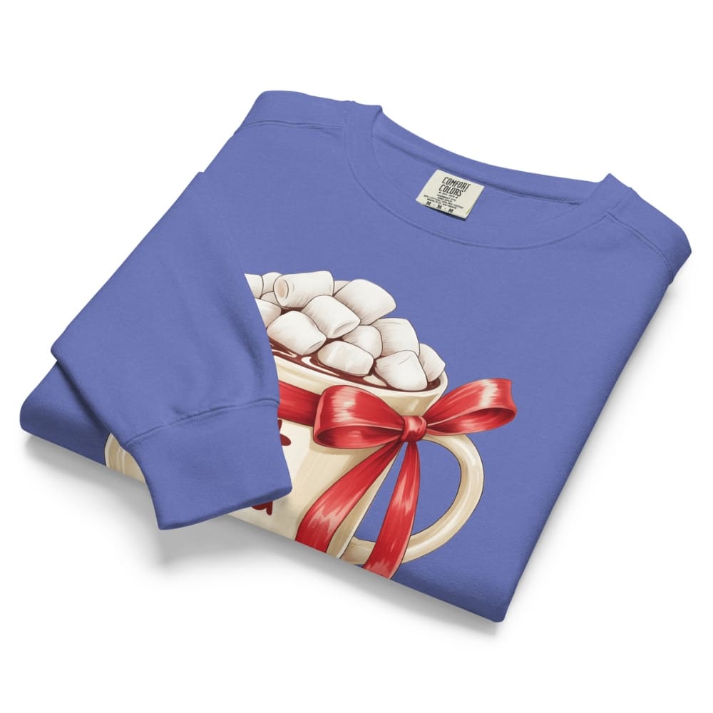 Folded blue sweatshirt with hot chocolate graphic featuring a red bow on a white background