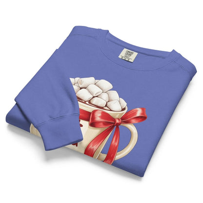 Folded blue sweatshirt with hot chocolate graphic featuring a red bow on a white background