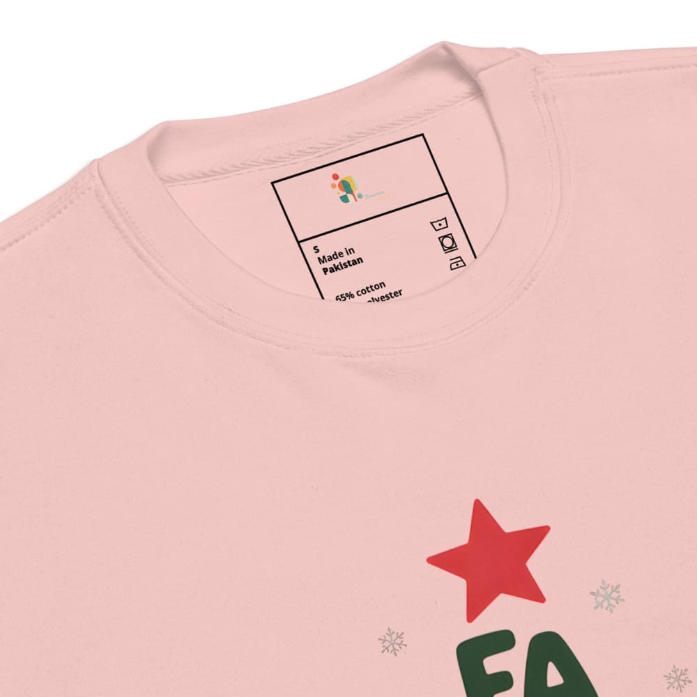 Pink t-shirt with a red star and green text on a white background