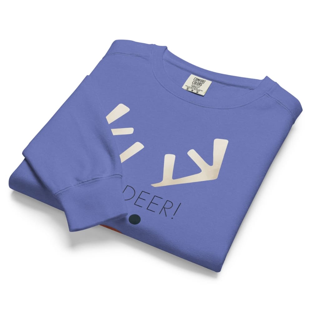 Folded blue sweatshirt with white graphic and text on a white background