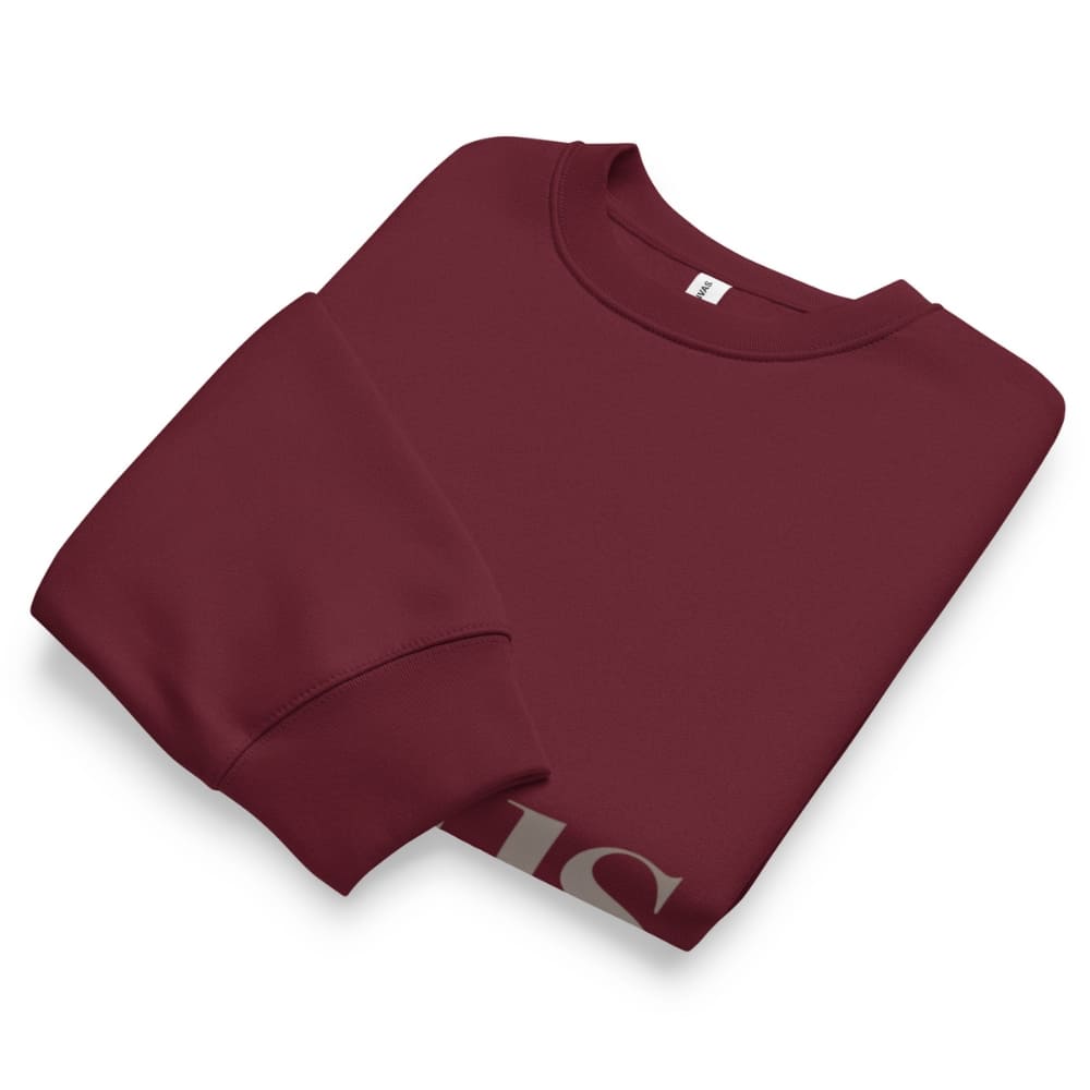 Folded maroon sweatshirt on a white background