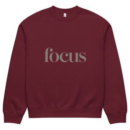 Maroon sweatshirt with 'focus' text on a white background