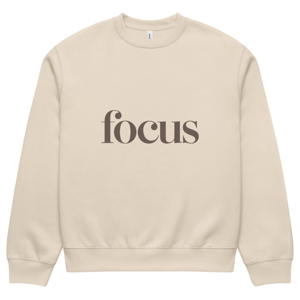 Beige sweatshirt with 'focus' text on a white background