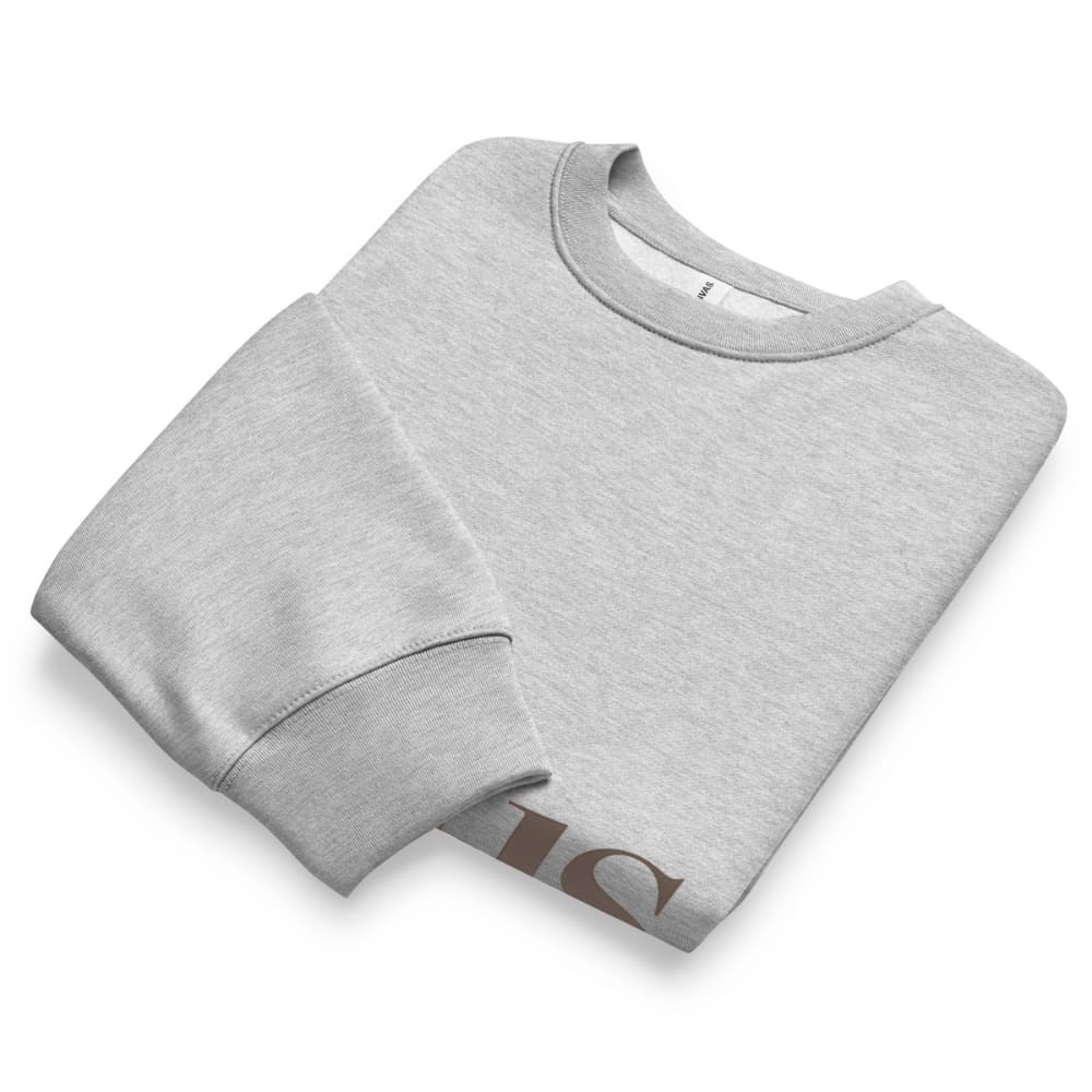 Folded gray sweatshirt with a brand logo on a white background