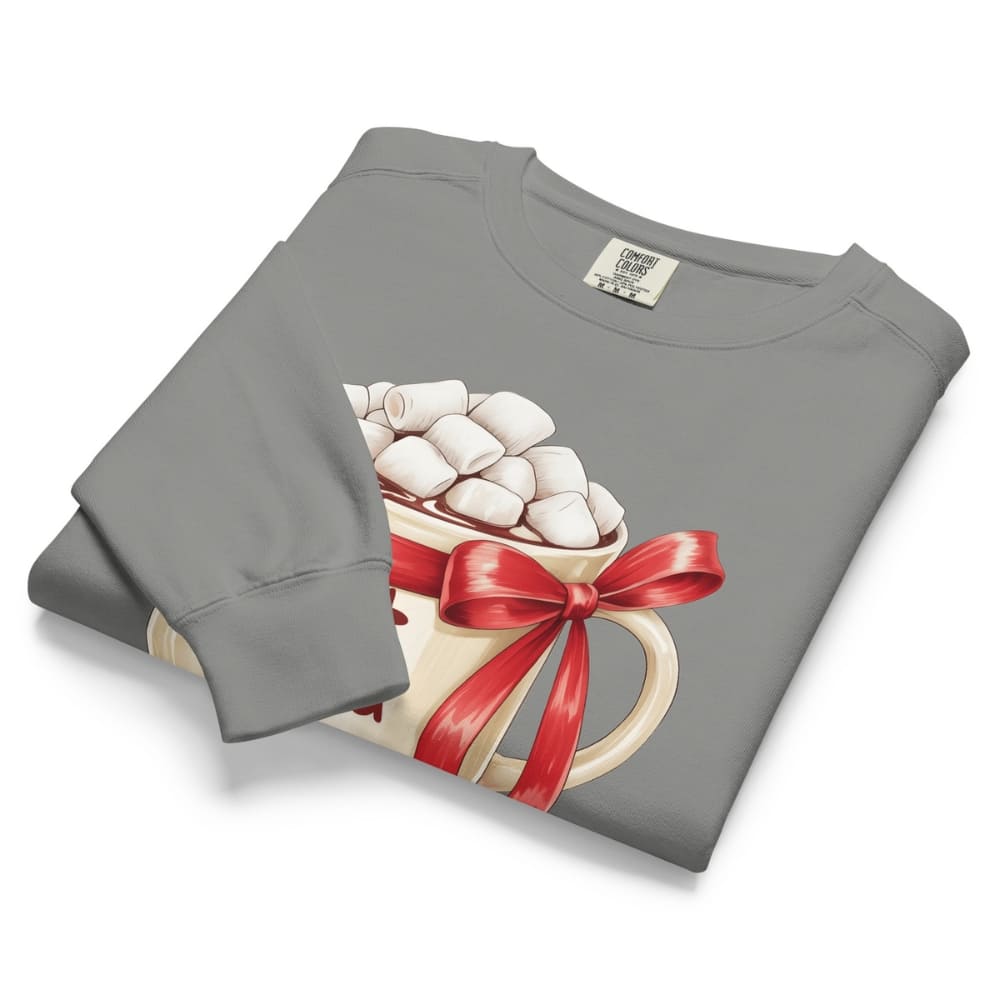 Folded gray sweatshirt with a hot chocolate graphic featuring marshmallows and a red bow on a white background.