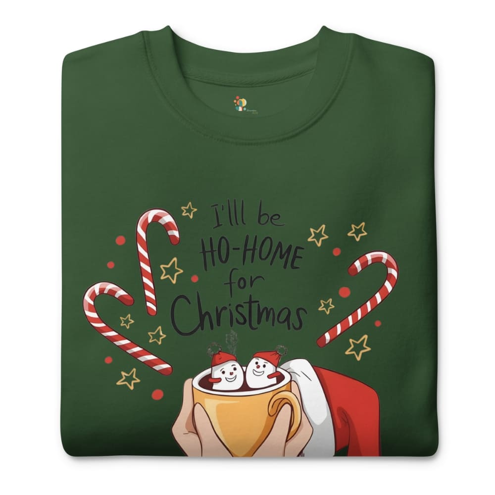 Green t-shirt with Christmas-themed design featuring candy canes, stars, and a cup with marshmallows.