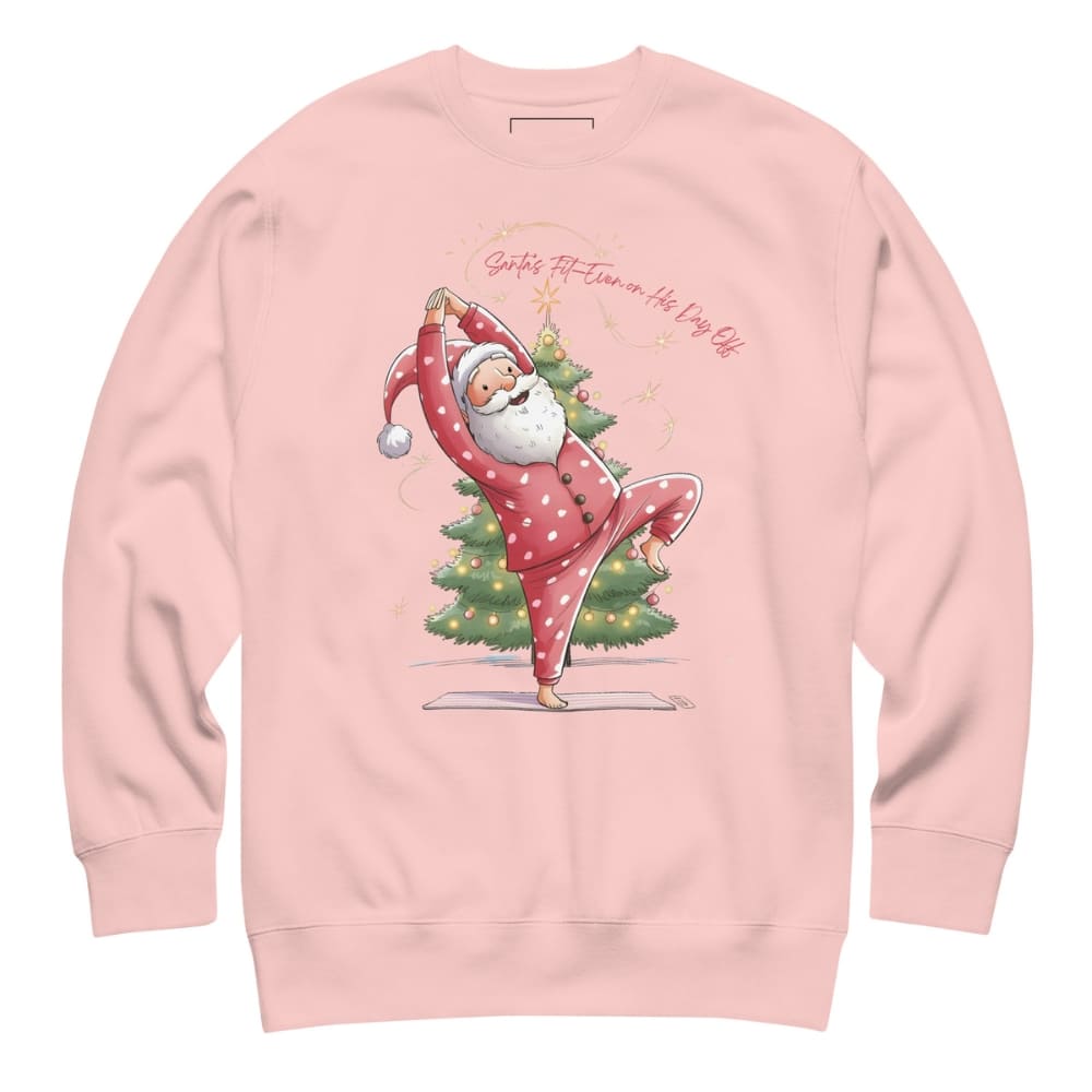 Pink sweatshirt with a cartoon Santa Claus doing yoga next to a Christmas tree on a white background