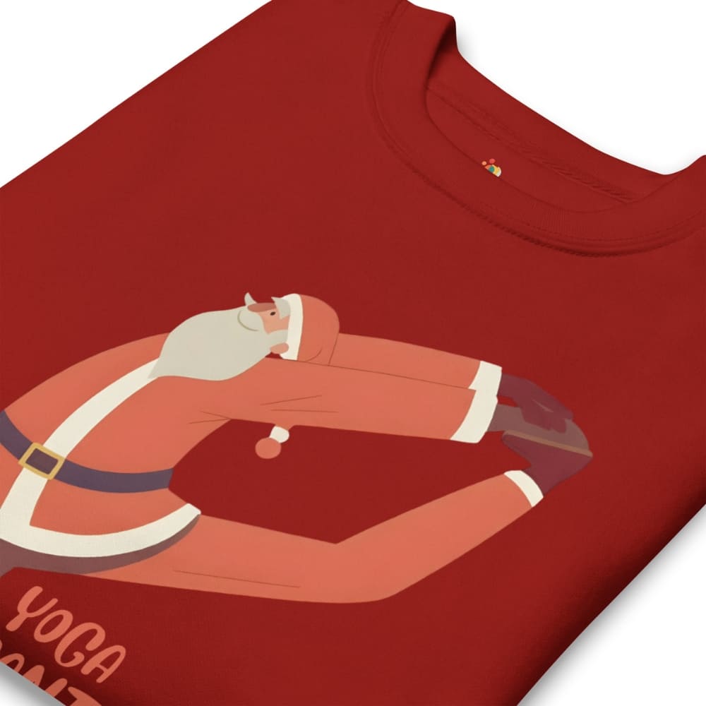 Red t-shirt with a graphic of a person in a yoga pose, wearing a Santa hat and beard.