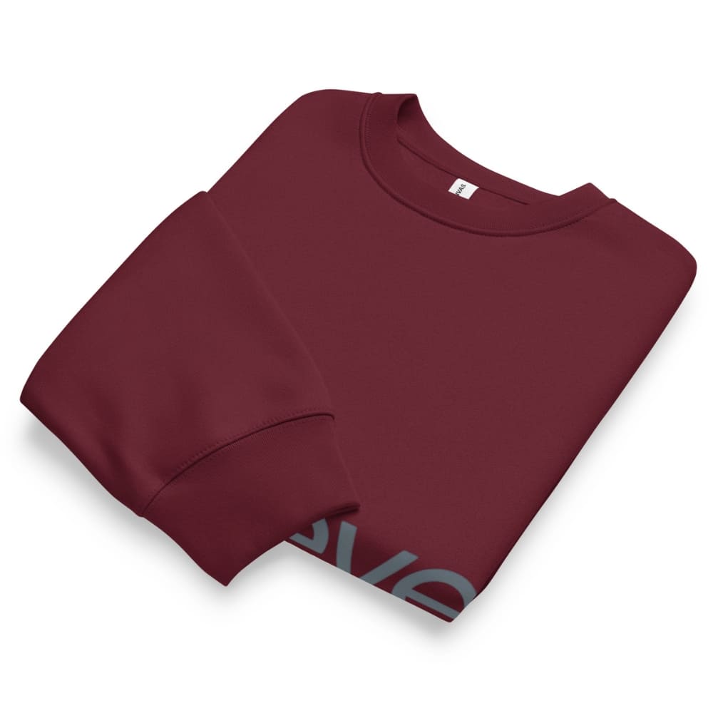 Folded maroon sweatshirt on a white background