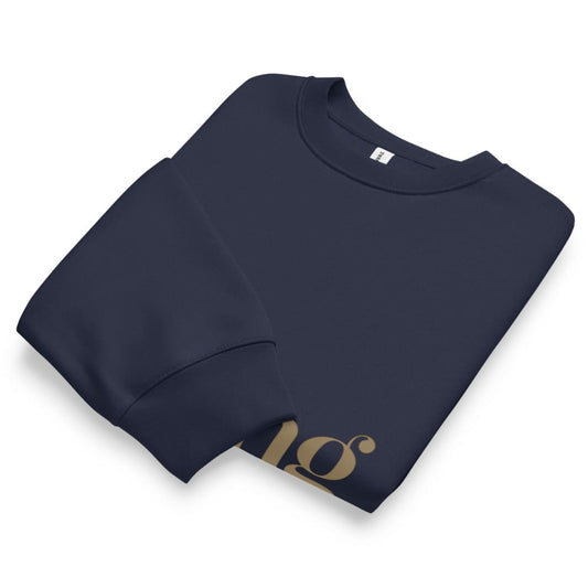 Folded navy blue sweatshirt with a logo on a white background