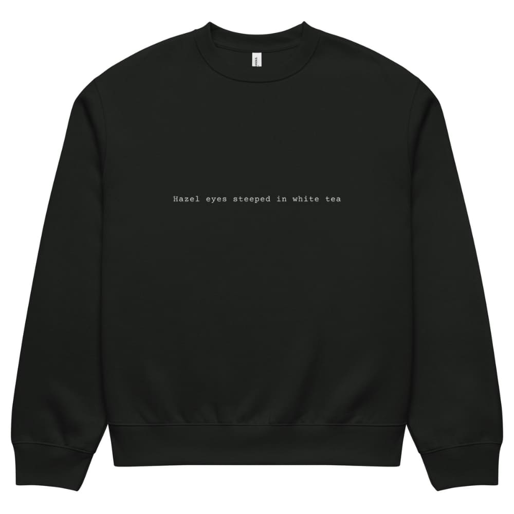 Black sweatshirt with text 'Hazel eyes steeped in white tea' on a white background