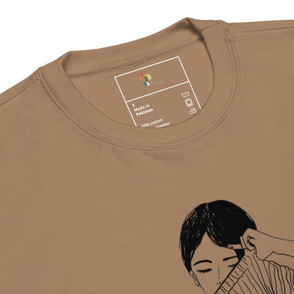 Brown t-shirt with a graphic of a woman getting her hair done, featuring a brand label.