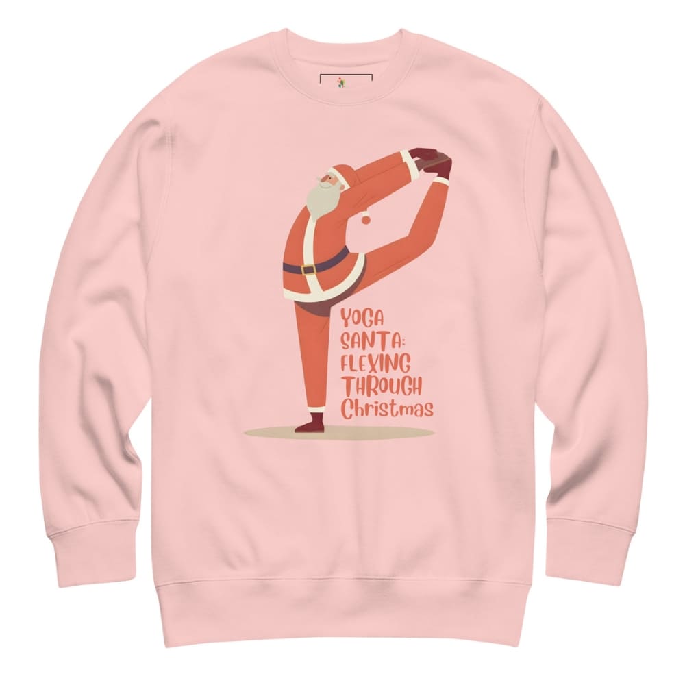 Pink sweatshirt with a graphic of Santa Claus doing yoga and text 'Yoga Santa Flexing Through Christmas' on a white background.